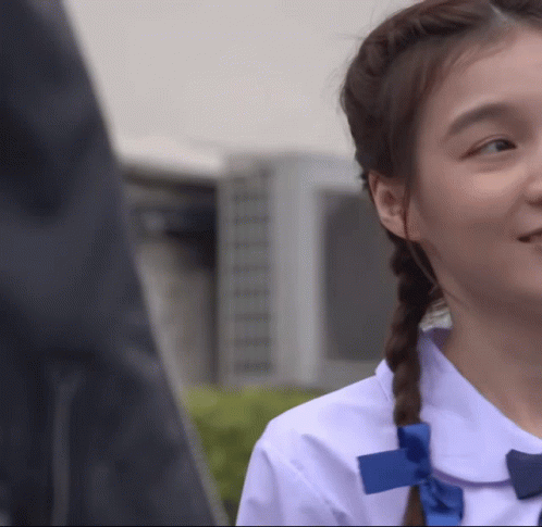 Girl In White Shirt With Blue Bow GIF
