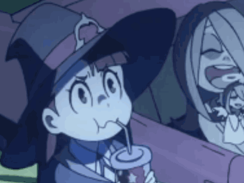 Girl in Witch Hat Drinking Through Straw