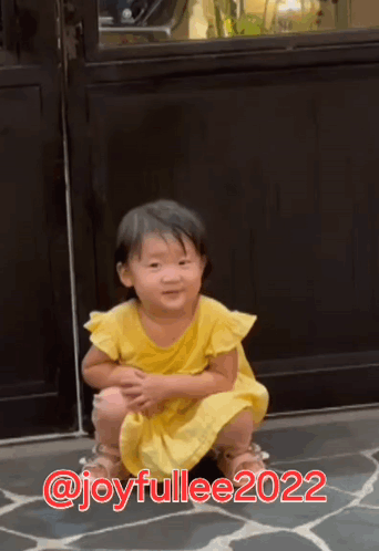 Girl in Yellow Dress Squatting