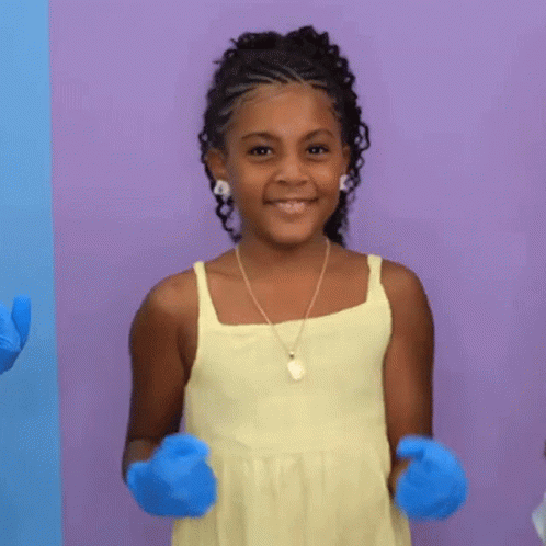 Girl in Yellow Tank Top and Blue Gloves