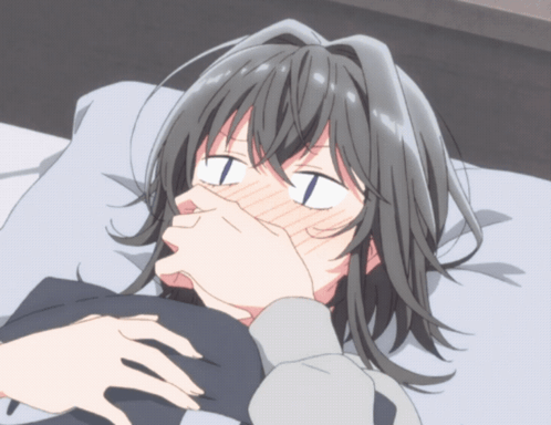 Girl Laying On Bed Covering Mouth With Hands GIF
