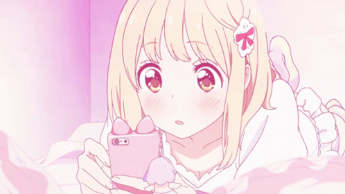 Girl Laying On Bed Looking At Cell Phone GIF