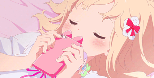 Girl Laying on Bed Looking at Phone