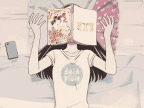 Girl Laying on Bed With Book Covering Face