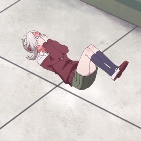 Girl Laying On Floor With Legs Crossed And Head Down GIF