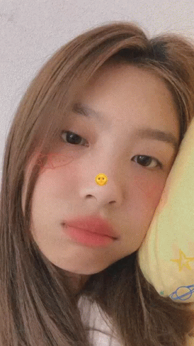 Girl Looking At Camera With Smiley Face On Nose GIF