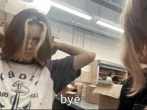 Girl Looking At Mirror Saying Bye GIF