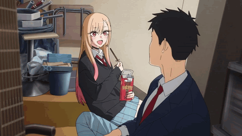 Girl Next to Man Holding Box of Pocky Sticks
