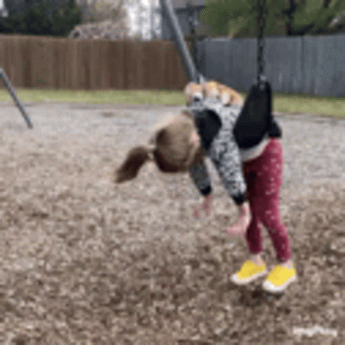 Girl Playing on Swing