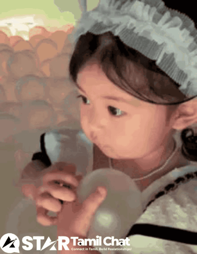 Girl Playing with Balloon and Star Logo