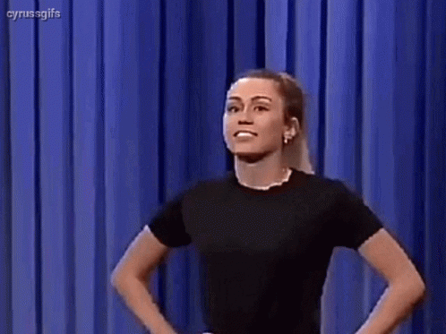 Girl Power Miley Cyrus Kissing Muscles GIF