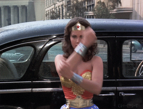 Girl Power Vintage Wonder Woman Deflecting Bullets GIF