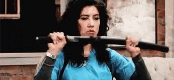 Girl Pulling Out Sword GIF