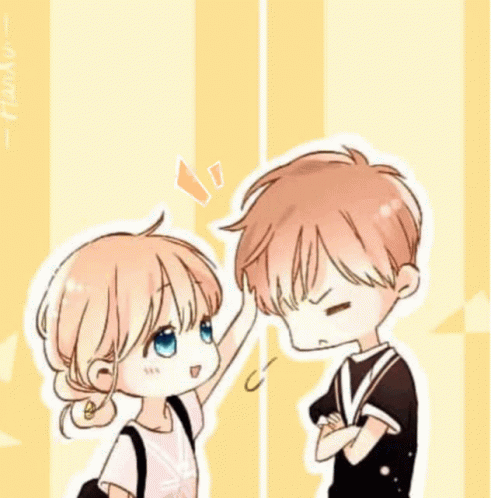 Girl Putting Hand On Boy's Forehead GIF