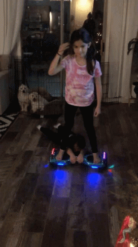 Girl Riding Hoverboard in Living Room