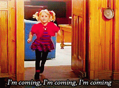 Girl Running Through Doorway Saying Im Coming