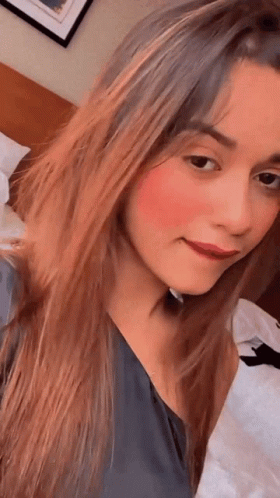 Girl Saying Mmm While Holding Chin GIF