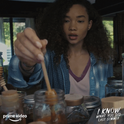 Girl Scooping Honey From The Jar GIF