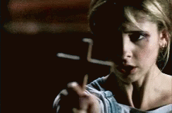 Girl Shaking While Holding Cross GIF