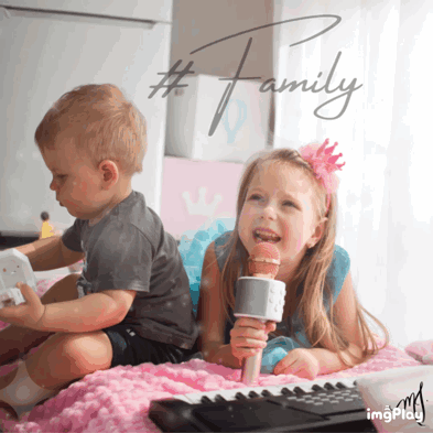 Girl Singing Into Mic Beside Boy Playing Toy Piano GIF
