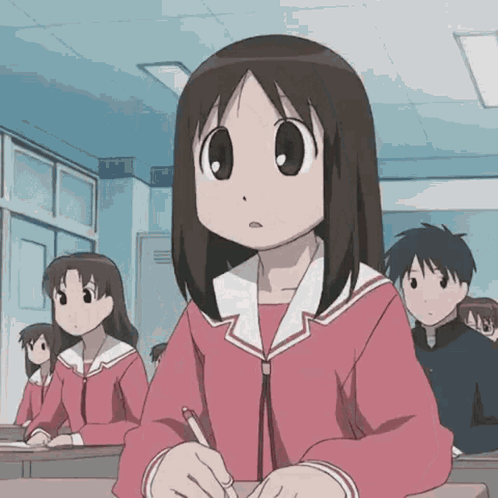 Girl Sitting At Desk In Classroom GIF