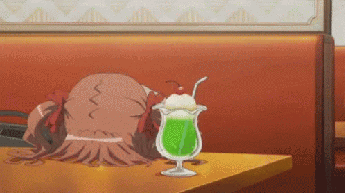 Girl Sitting At Table With Green Drink And Cherry GIF