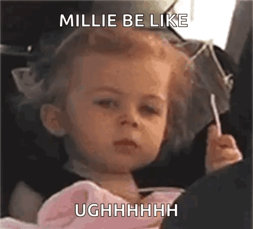 Girl Sitting in Car Seat with Lollipop