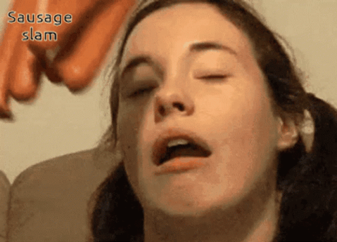 Girl Slapped By Sausage GIF