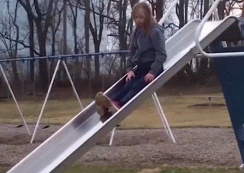 Girl Slowly Going Down The Slide GIF