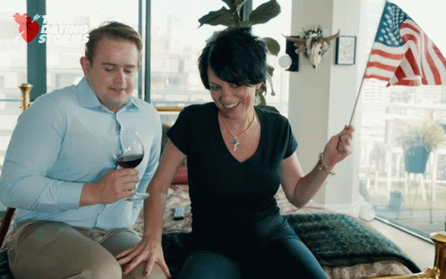 Girl Smiling Holding American Flag Waving GIF