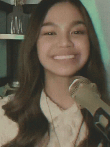 Girl Smiling Holding Microphone