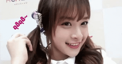Girl Smiling In White Shirt And Plaid Scarf GIF