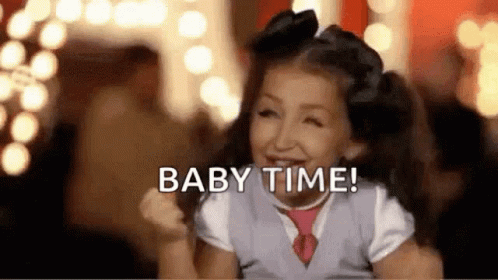 Girl Smiling Saying Baby Time With Tie And Bow
