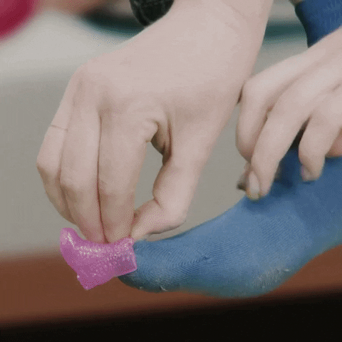 Girl Squeezing Small Shoe GIF