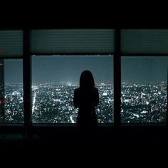 Girl Standing And Looking Out The Window GIF