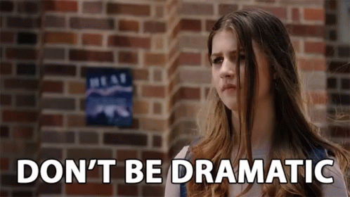 Girl Standing Before Brick Wall With Dnt Be Dramatic GIF