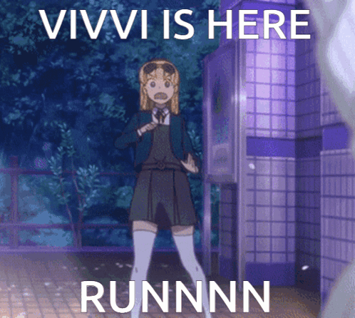 Girl Standing in Front of Vivi Is Here Sign