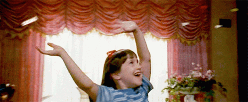 Girl Standing with Arms Outstretched
