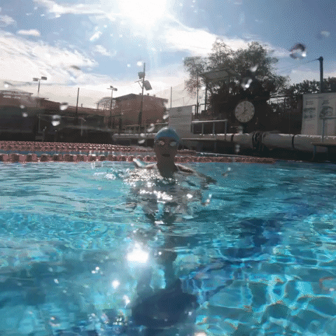 Girl Swimmer Smile And Wave Under The Water GIF