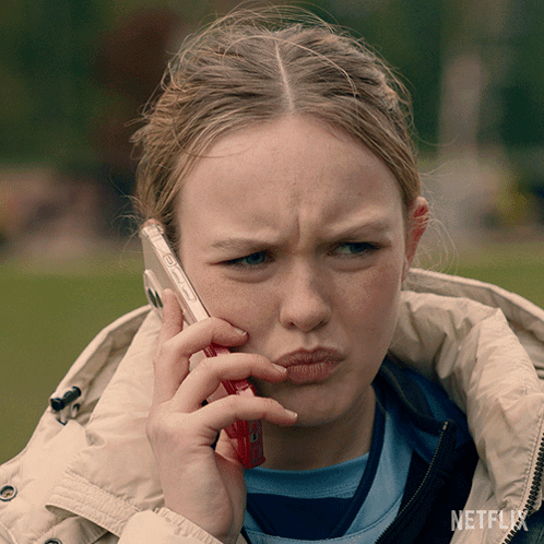 Girl Talking on Cell Phone With Netflix