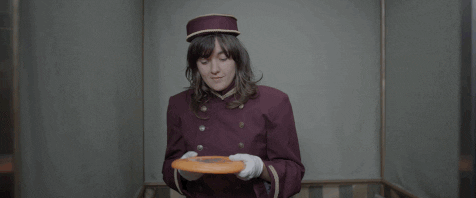 Girl Throws Frisbee Through Window GIF