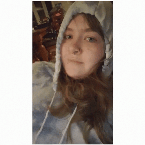 Girl Trying To Hide Face With Hoodie GIF