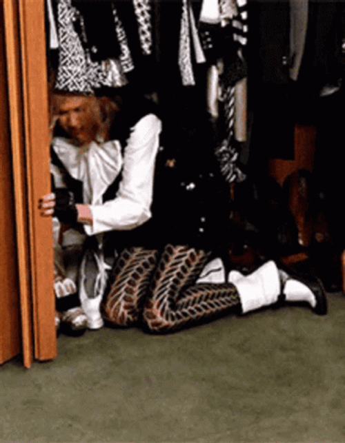 Girl Trying To Hide In Closet GIF