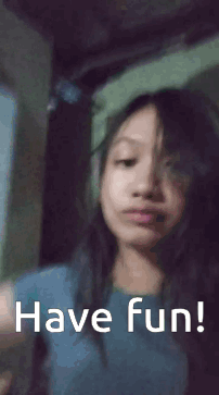 Girl Waving Saying Have Fun GIF