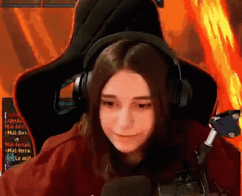 Girl Wearing Headphones Sitting in Chair