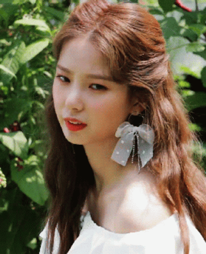 Girl Wearing White Off Shoulder Top and Earrings