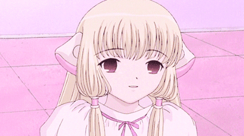 Girl With Blonde Hair And Pigtails Sitting GIF