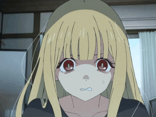 Girl With Blonde Hair And Red Eyes Making Face GIF