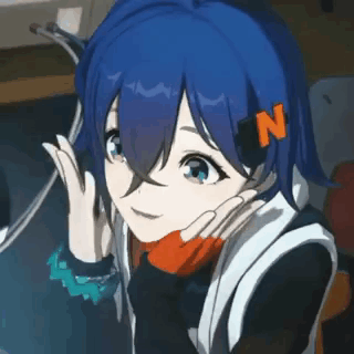 Girl With Blue Hair And N Sitting At Computer GIF