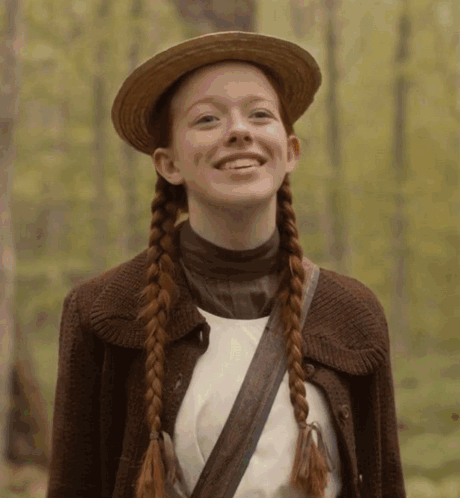 Girl With Braids in Straw Hat and Brown Jacket